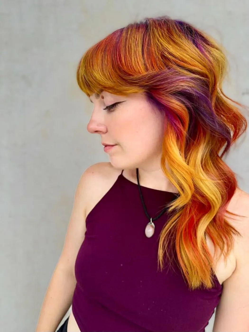 Fiery orange-to-purple color in side-swept waves