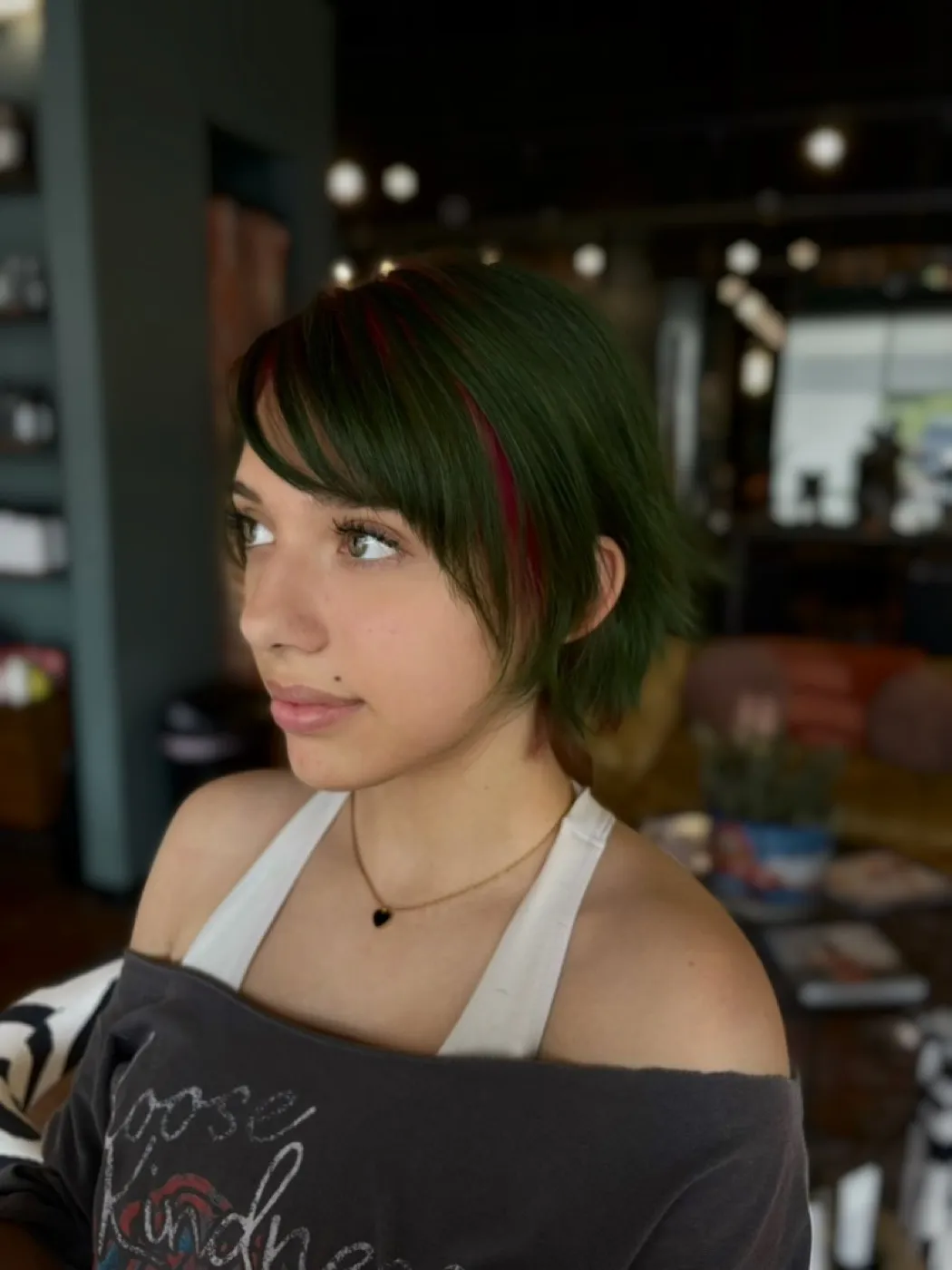 Green pixie cut with a red money piece
