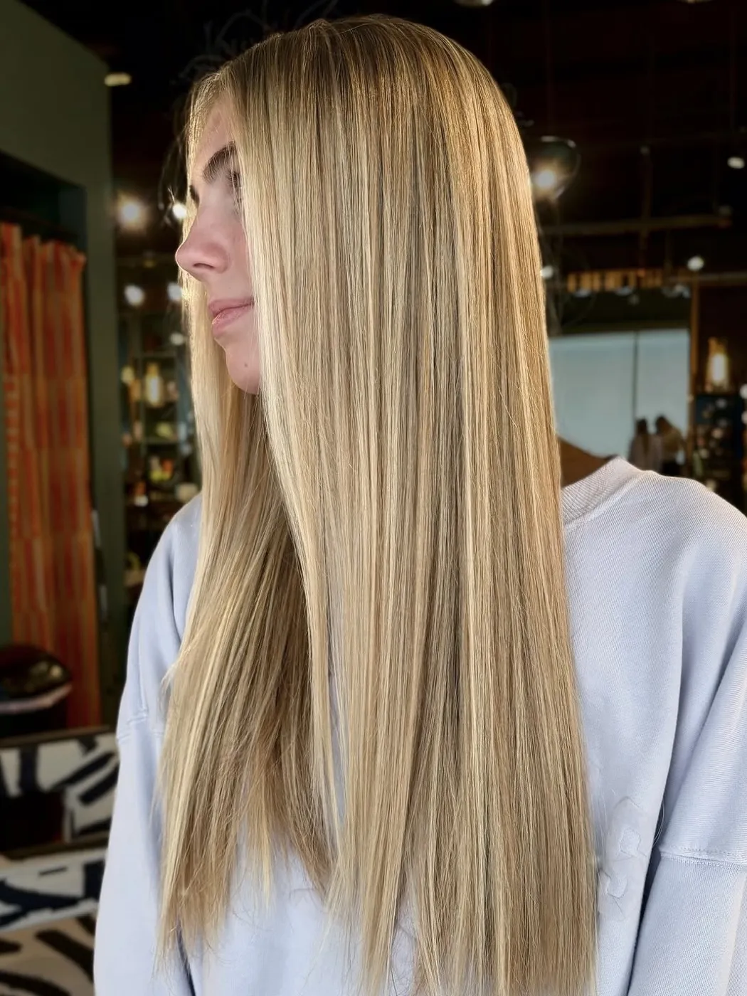 Long, sleek dimensional blonde with a bright money piece