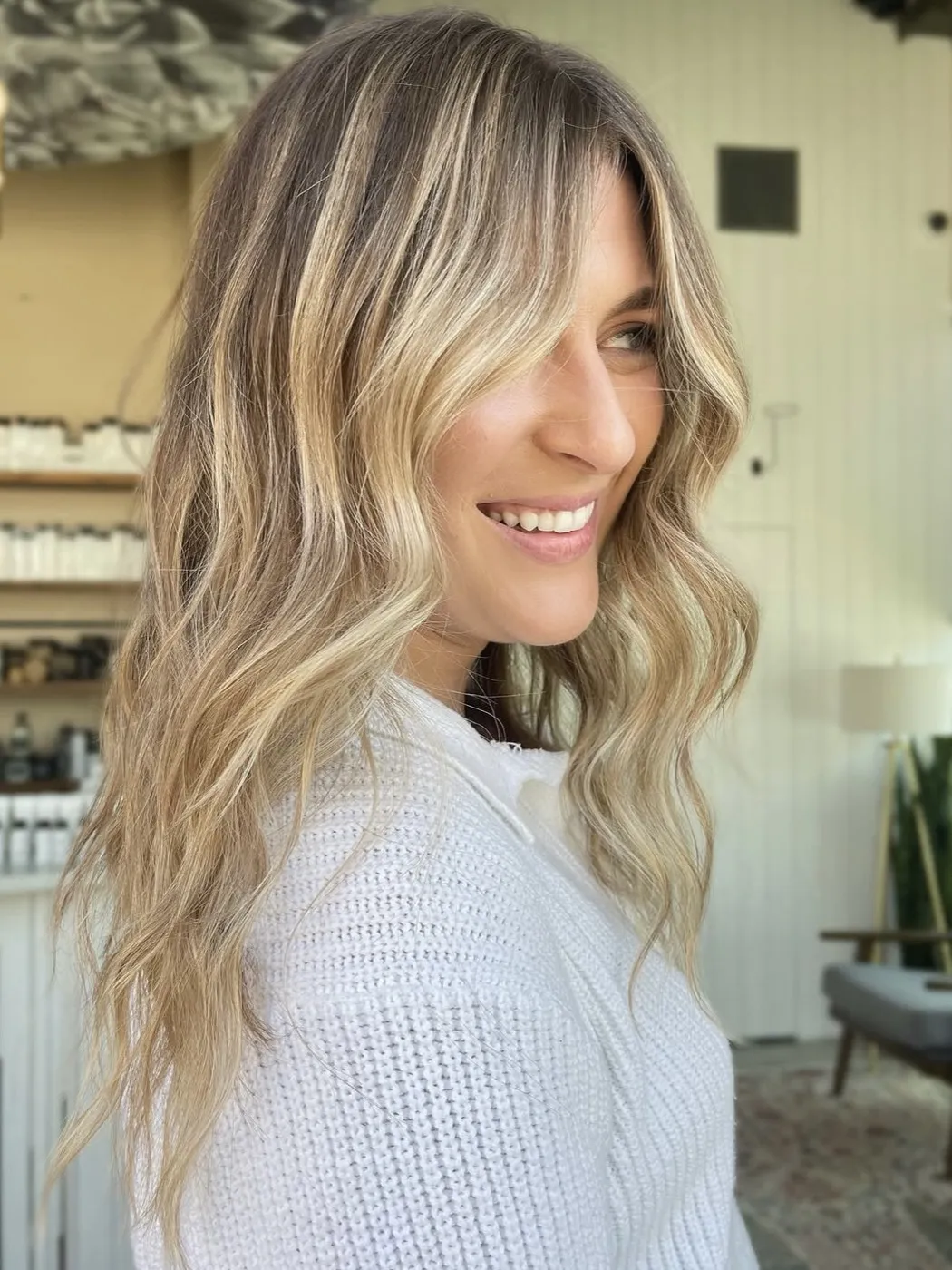 Dimensional blonde with soft waves and a money piece