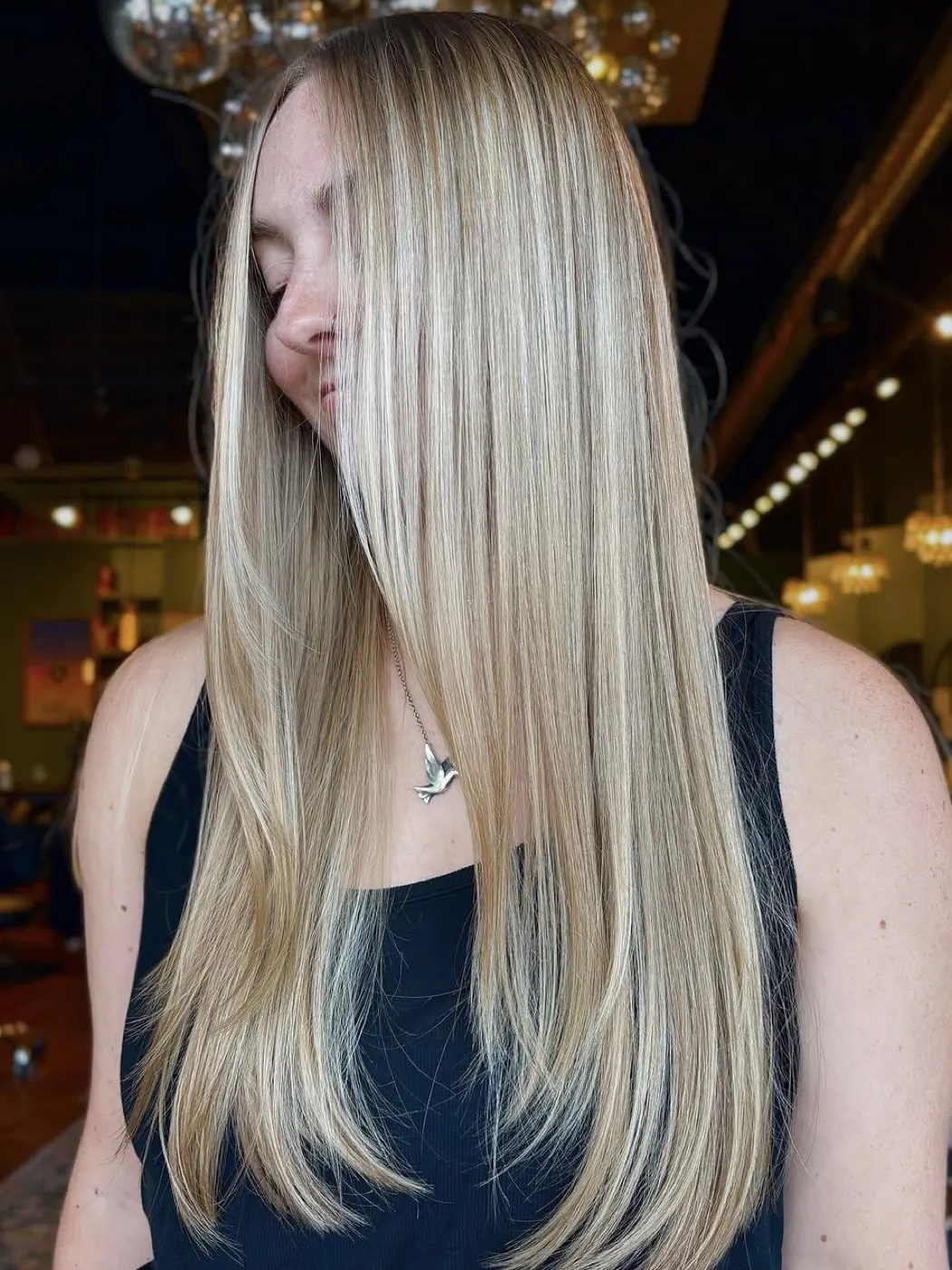 Sleek, dimensional blonde worn straight